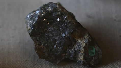 black sparkly rock on a brown material