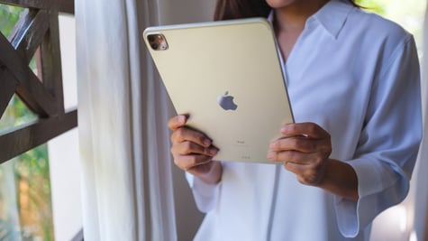 Woman holding iPad Pro
