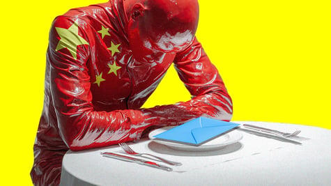 china flag man sitting on the table looking at a mail letter