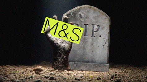 m&S in black letters, yellow background, tombstone, R.I.P, sandy hand, gravel