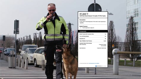 man in yellow jacket walks a German sheppard,