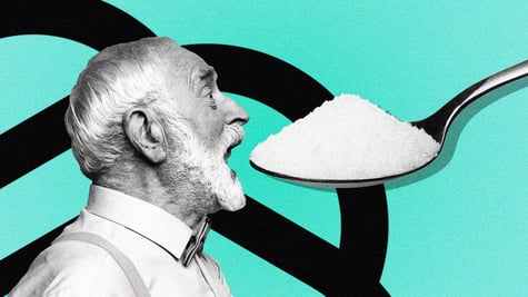 An elderly man trying to eat a huge out of proportion spoonful of salt.