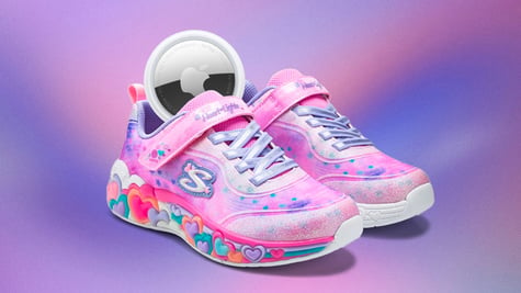pink shoe with colorful hears on the sole with silver Apple disc