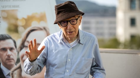 American director Woody Allen waving at camera