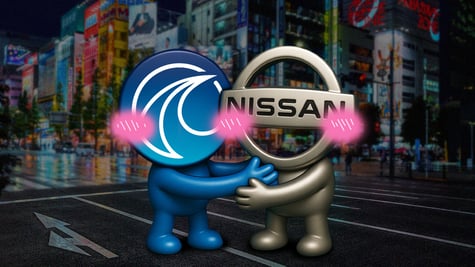 The Wayve and Nissan logos embracing on the streets of Tokyo.