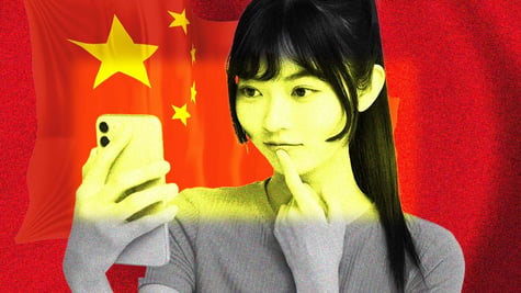 An influencer looking at her phone with Chinese flag on the background
