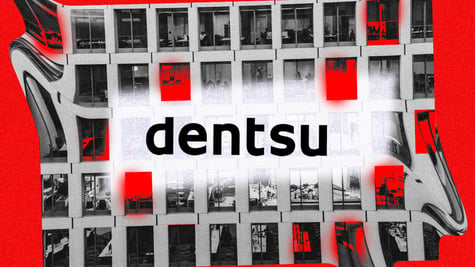 Dentsu logo with an office building