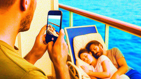 Someone filming a sleeping couple on their balcony on a cruise-ship.