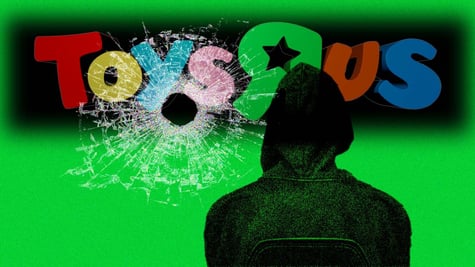 Toys 'R' Us logo with a bullet hole