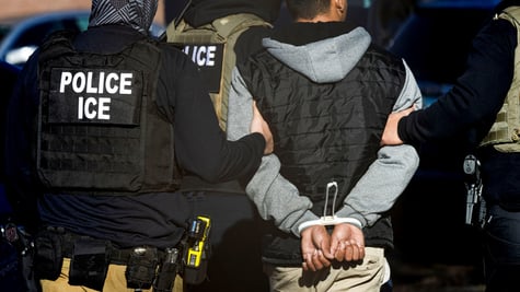 police officers back, black vest, ice
