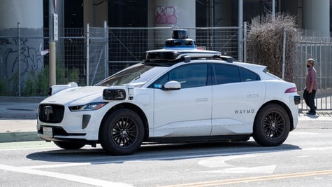 Waymo self-driving cart parked in street