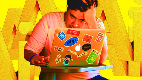 An employee looking at their laptop with letters AI in the background