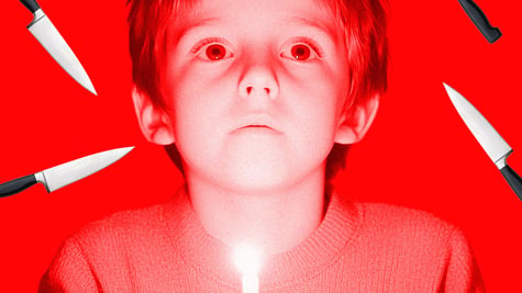 A child surrounded by knives