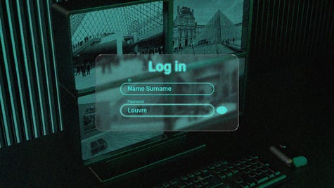 A laptop with the Louvre's photos on a desktop