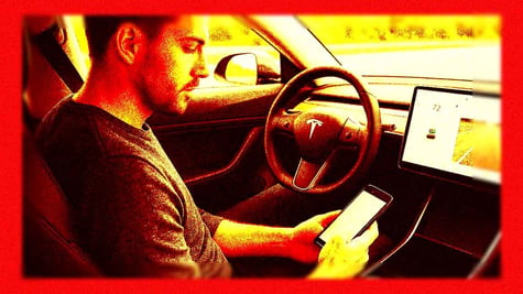 Driver texting in Tesla