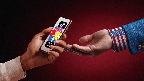 Two hands, one of the presidents, a smartphone with social media icons on the display.