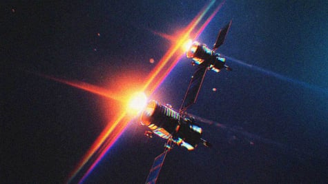 Two space satellites, passing each other, like ships in the night.