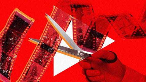 A hand hold holding scissors cutting film roll, Youtube's logo