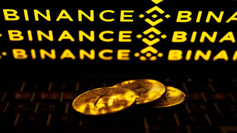 Bitcoin coins with Bitcoin crypto exchange logo in the background
