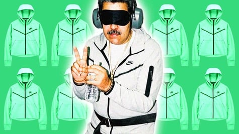 General Maduro in a grey Nike tracksuit and sleeping mask, doing the peace sign.