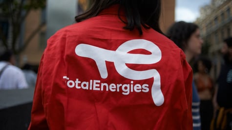 TotalEnergies logo on a persons back