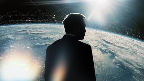 Elon Musk's silhouette over planet Earth.