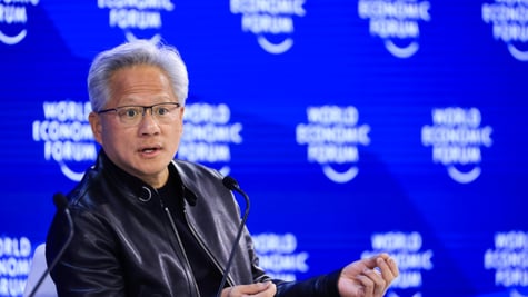 Jensen Huang, grey hair, black leather jacket, blur photo wall, world economic forum
