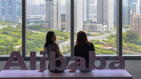 alibaba_White Alibaba logo, 4 big windows, city park, big buildings, two asian girls