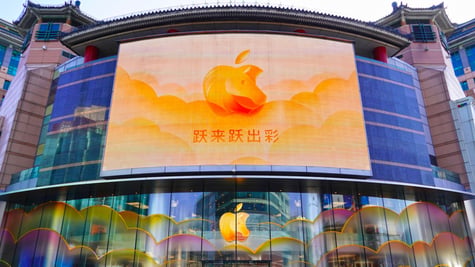 orange apple logo in China with Chinese sign and horse motif