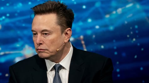 elon musk facing left, blue background, little white web-like lights, black suit 