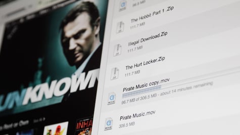james-bond-ish movie poster on left, shadowy man's face, black suit, white download page with files