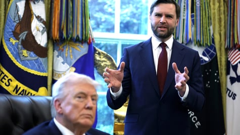 JD Vance gesticulating as Donald Trump looks on