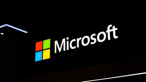 The Microsoft corporate logo is illuminated at the Fira Gran Vi