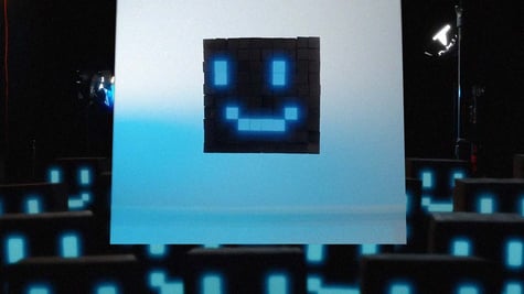 A face made from blue tetri-like blocks that looks like on a computer screen