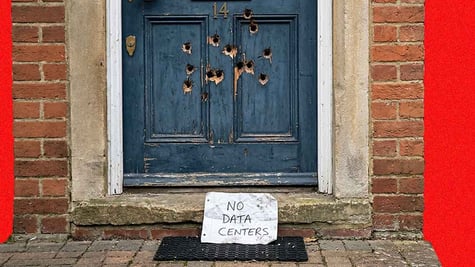 Thirteen bullet shots left in a door with a "No date Centers" note under the doormat.