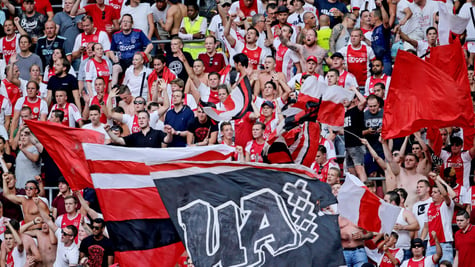 ajax club supporters, red and white flags, red and white shirts in crowd in stadium
