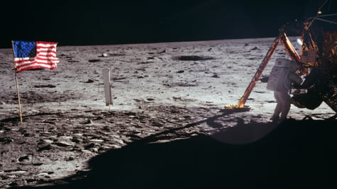 neil armstrong, white space suit, moon surface, grey crator, usa flag