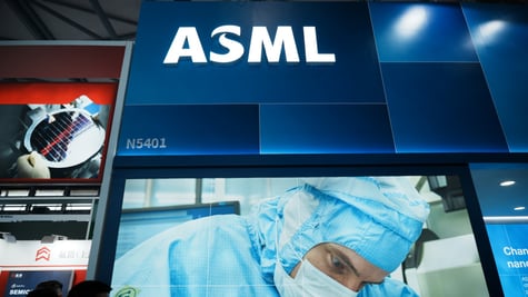 asml white letters shining above booth, doctor in light blue scrubs, face mask, 