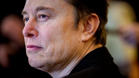 elon musk, profile, black suit, face close up, curly eyebrow, wrinckles on face skin