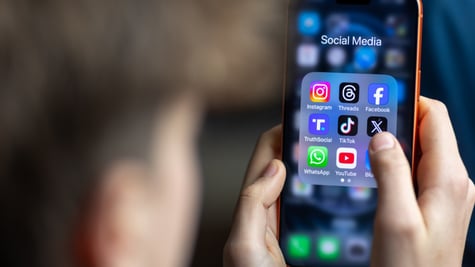 young teen boy, grown hair, iphone black screen with Instagram, Youtube, Facebook ,TikTok apps