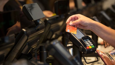 Payment card with a human hand. 