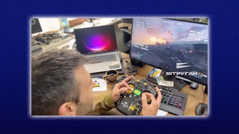 person controls drone