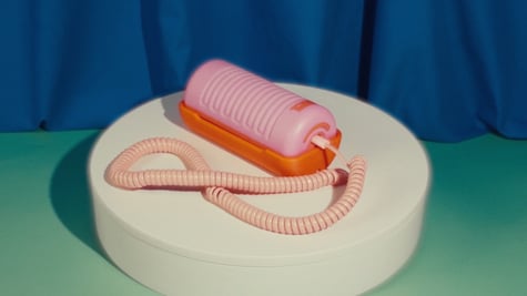 Tin Can landline phone in pink and orange
