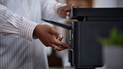 Woman using a black printer