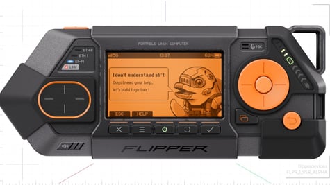 black plastic device with orange screen, dolphin image