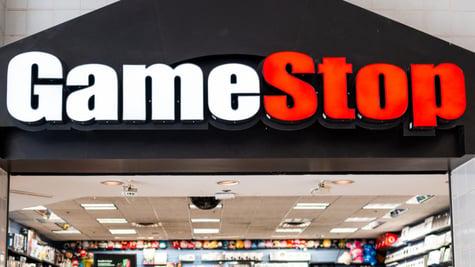 game stop logo above a physical shop with computer games, white and red letters, black back 