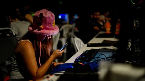 tenage girl, fluffy pink had, smartphone, computers, dark, tanned white skin, dark room