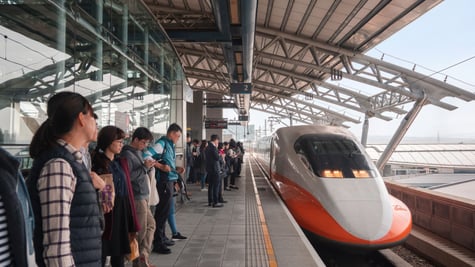 People waiting in a station for high-speed train