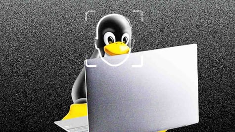 linux penguin, grey laptop, dark grey background