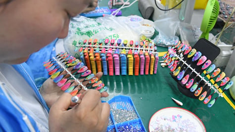 manicure, white chinese woman face, orange, pink, lemon green, yellow plastic nails.